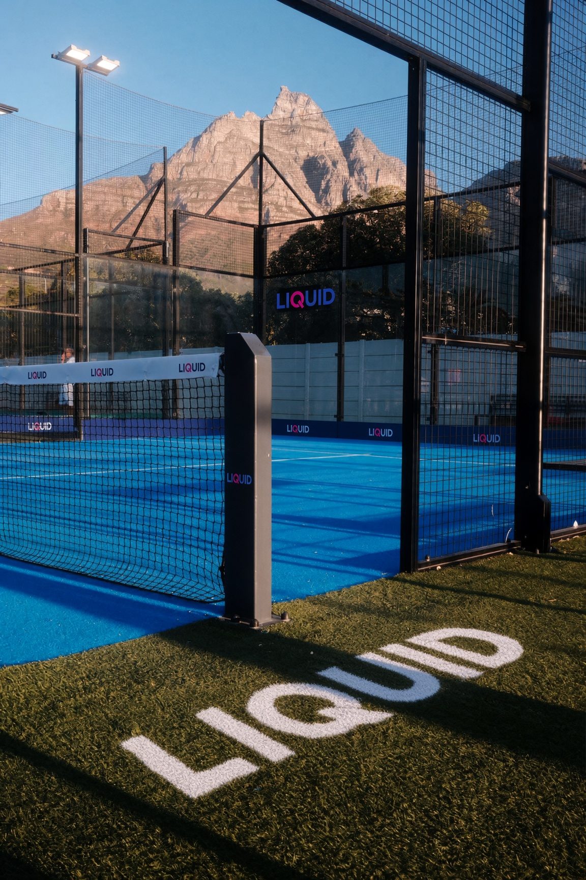 Sponsor name painted on the turf at the court entrance